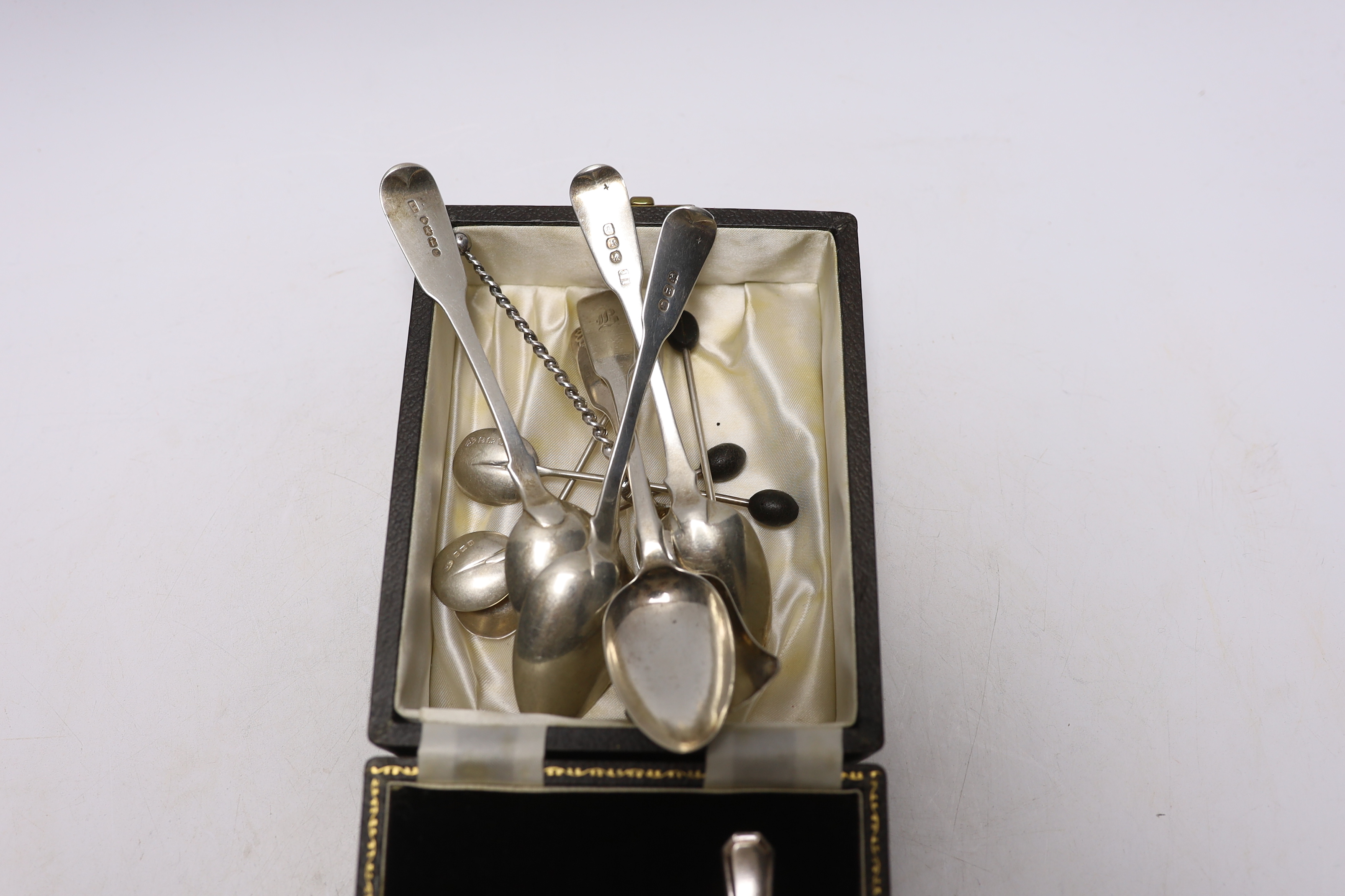 A cased silver egg cup, spoon and other assorted silver flatware.